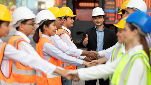 warehouse boss engineer thumbs up pose and factory workers shaking hands for congratulations in containers warehouse storage