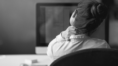 Rearview shot of a businesswoman suffering from neck pain at the officehttp://195.154.178.81/DATA/i_collage/pi/shoots/806127.jpg