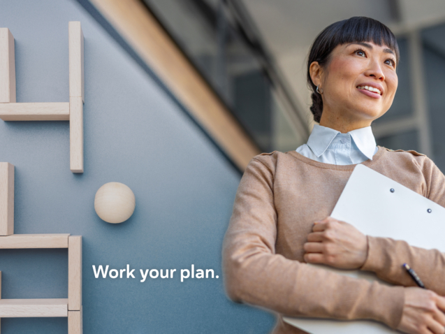 Japanese businesswoman holding a writing pad in her hands ready for a meeting | TeamsynerG Global Consulting